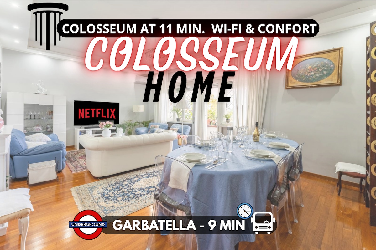 A spacious dining area is highlighted by a large round table set for dining. Elegant tableware is arranged neatly, surrounded by comfortable chairs. A soft-toned carpet adds warmth, while a painting adorns the wall, contributing to a welcoming ambiance.