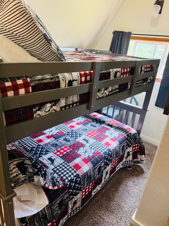 Bunk Room: Fun layered beds dressed in vibrant quilts for a playful night's sleep!