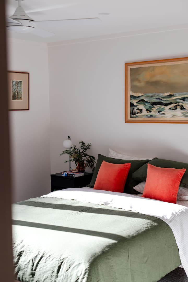 Light filled bedrooms with luxury bedding and linens