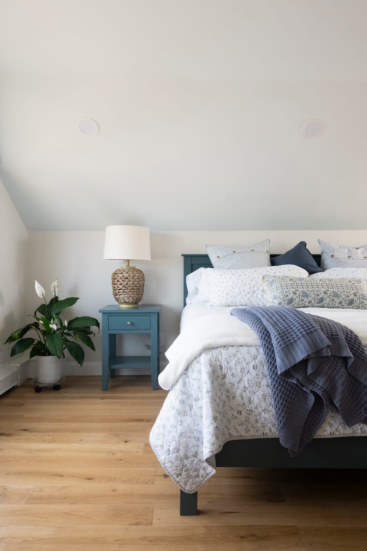 Harbor view bedroom.nEnjoy a restful night's sleep on our premium Buckingham Plush Mattress, offering the perfect balance of plush comfort and supportive cushioning.