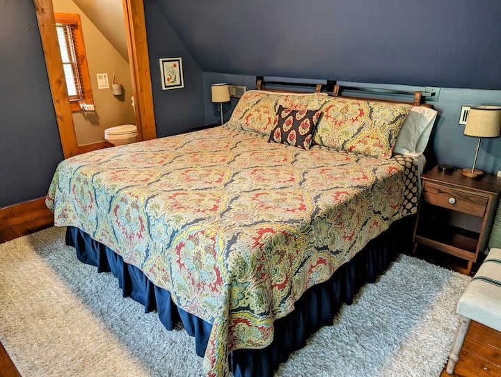 The bedroom and full bath are located on the 2nd floor. The staircase to access them is approximately a dozen stairs. 