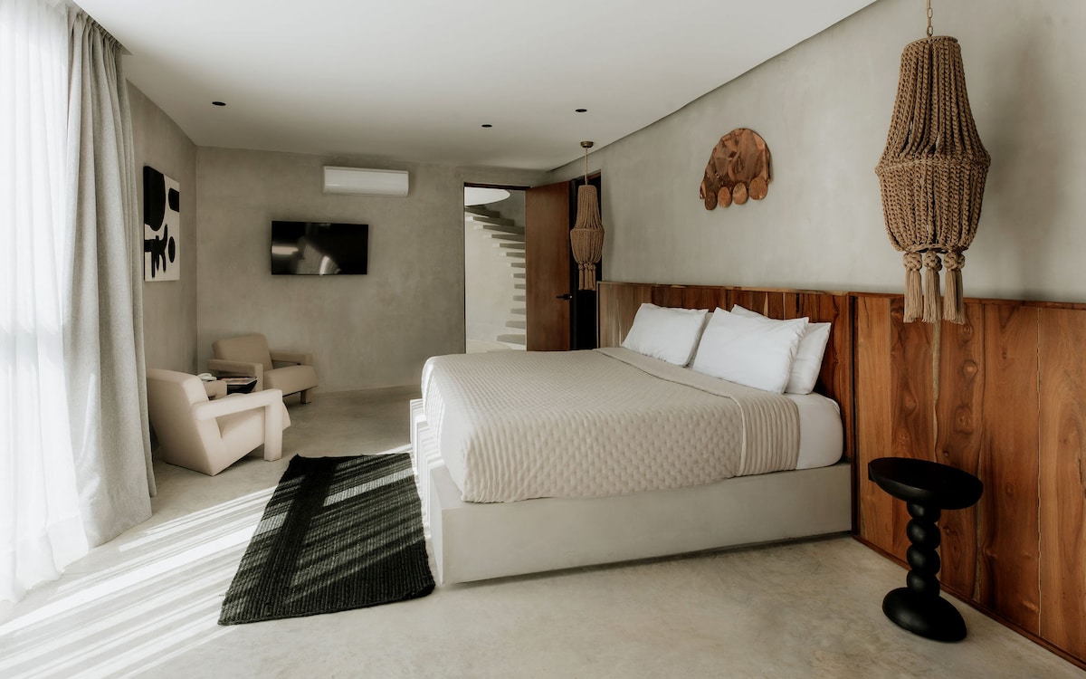 The master bedroom is thoughtfully curated with carefully chosen pieces, offering an elegant, peaceful, and relaxing retreat for the ultimate restful experience.