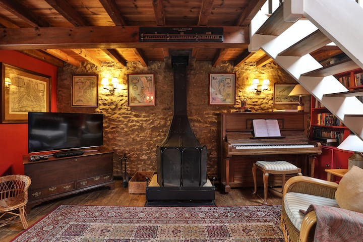 This room aka 'The Minstrel's Gallery' is very cosy and has a TV, a fire, a piano, a bar billiards table, a sofa bed downstairs and lots of books and games to read and play. On the gallery is a double bed and small work area.