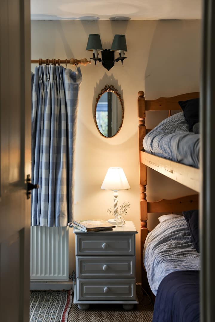 This bedroom has bunk beds and a huge teddy so it is perfect for kids! It is right next to the ensuite bedroom so if you leave the door open it is easy to keep an ear out for younger children.