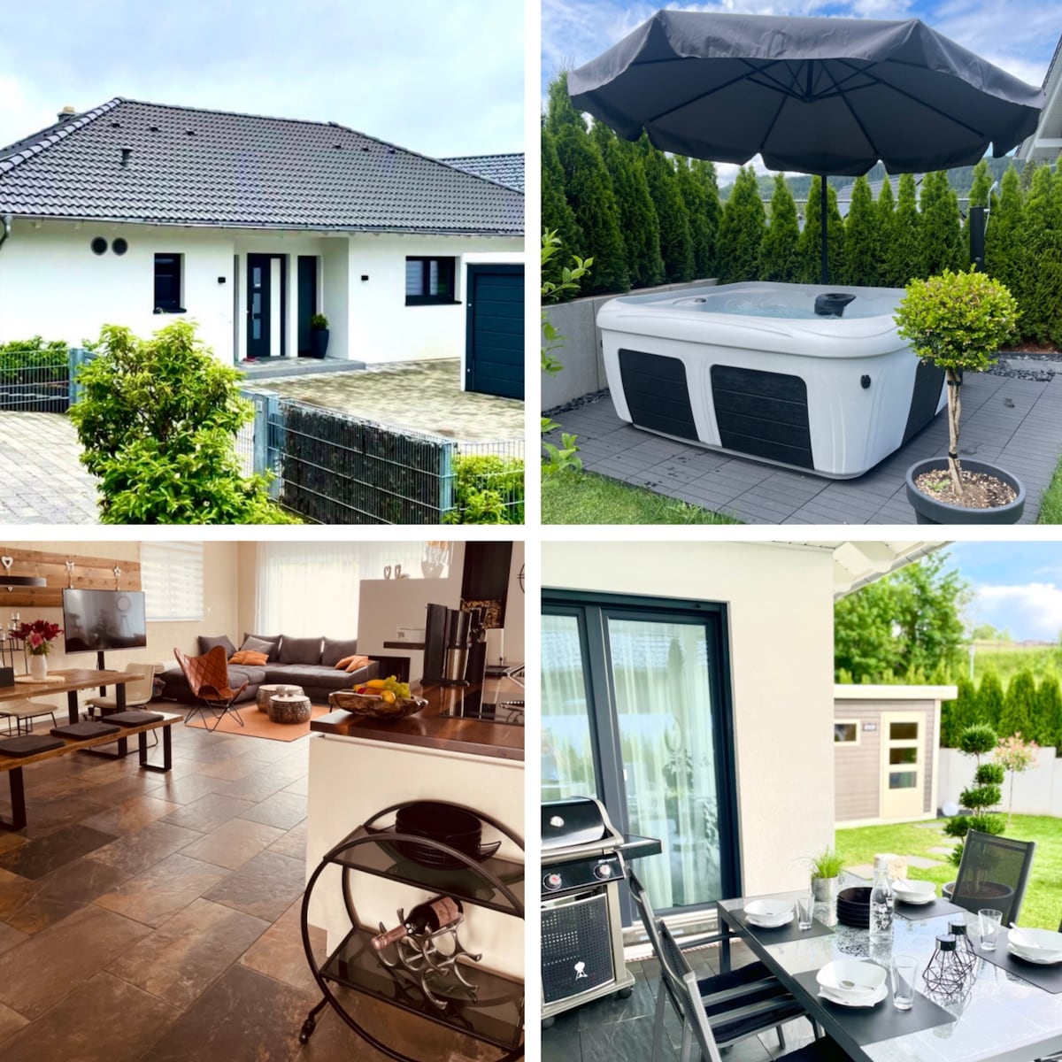The exterior of a modern house is shown, featuring a light-colored façade and a neatly landscaped front yard. A spacious patio area includes a luxurious hot tub, shaded by a large umbrella, surrounded by privacy hedges.