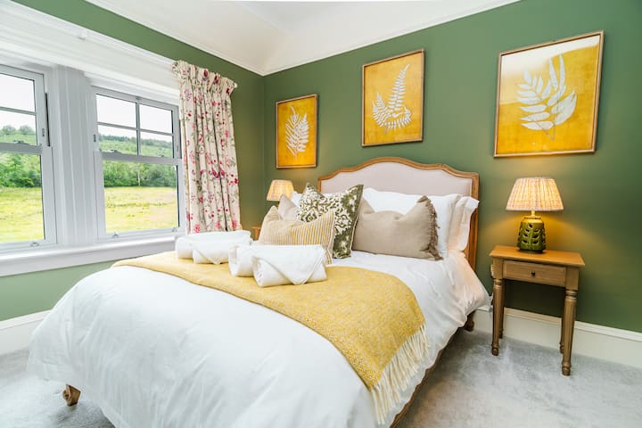 ROOM 9 - DOUBLE SIZE BED with a private shower ensuite, a rainfall shower, and beautiful views of the country hills.