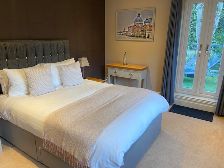 Bedroom 3 with access to roof-top balcony. King bed