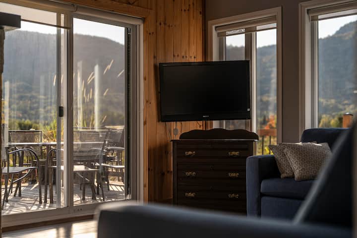 A spacious living room with elegant design and ample natural light.