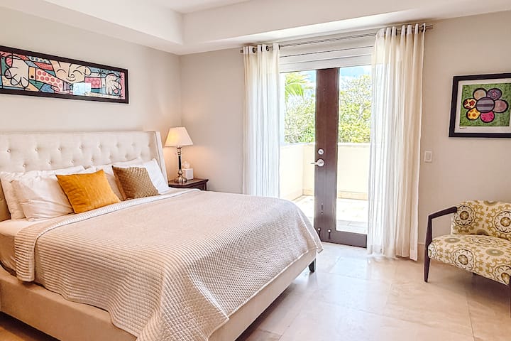 Stunning views of the balcony, complete with comfortable seating and a ceiling fan for added comfort.