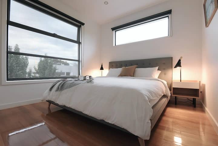 Slip into the luxury of our king-bed master bedroom, a spacious retreat designed for deep rest and rejuvenation.