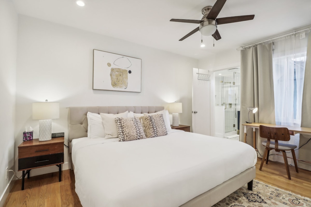 The master bedroom features a king bed with a memory foam mattress, computer station, and mount power strips with USB ports & AC outlets on each nightstand. Enjoy the ultimate comfort and convenience complemented by an en suite bathroom and a mirror