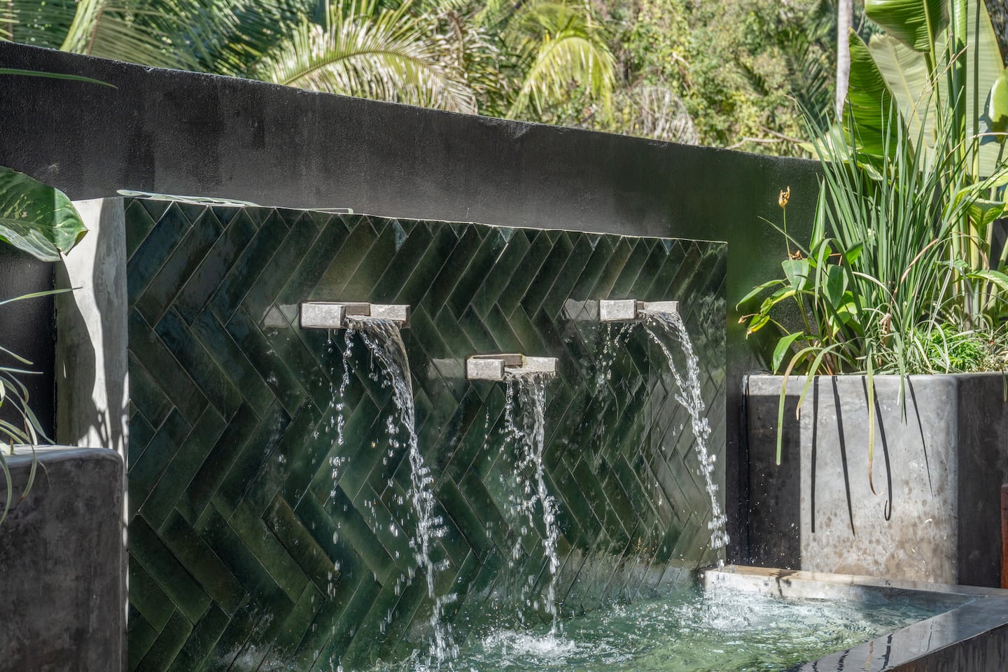 Sit by the water feature and listen. Three cascading jets all day, every day.