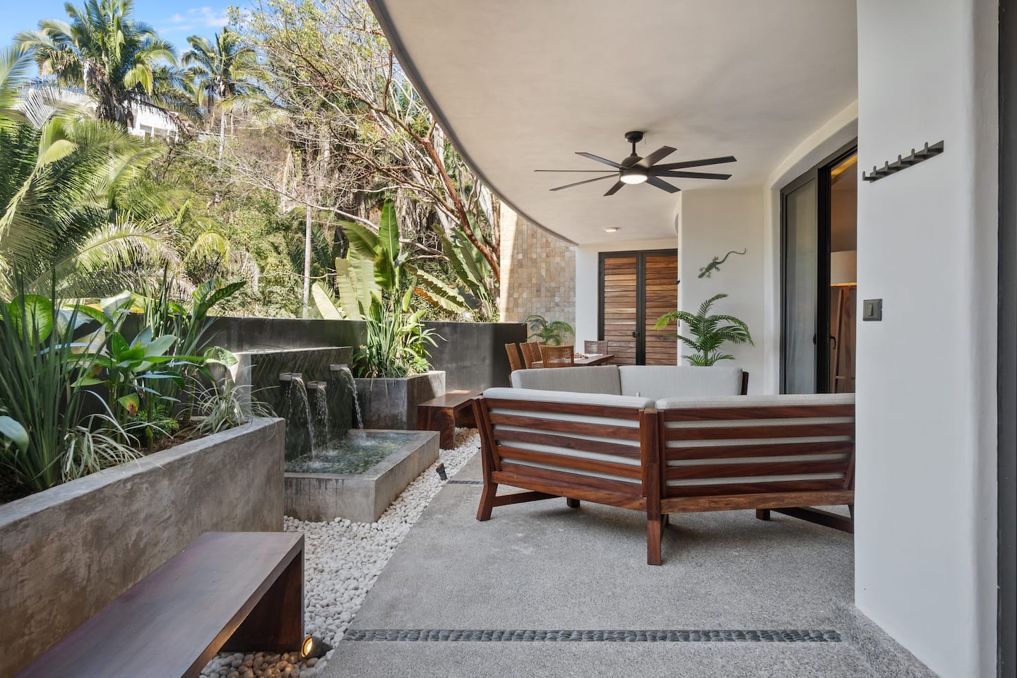 Your own shaded terrace off the bedroom. Morning coffee here hits different with the jungle in front.