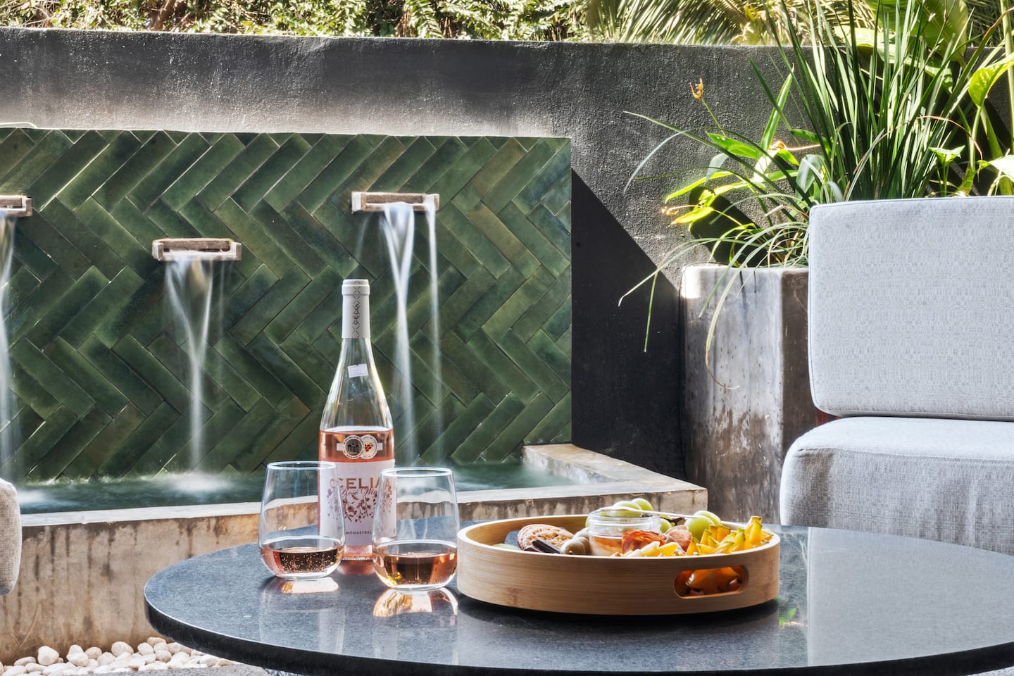 Pour the rosé, set out the snacks, and let the water feature do the talking.
