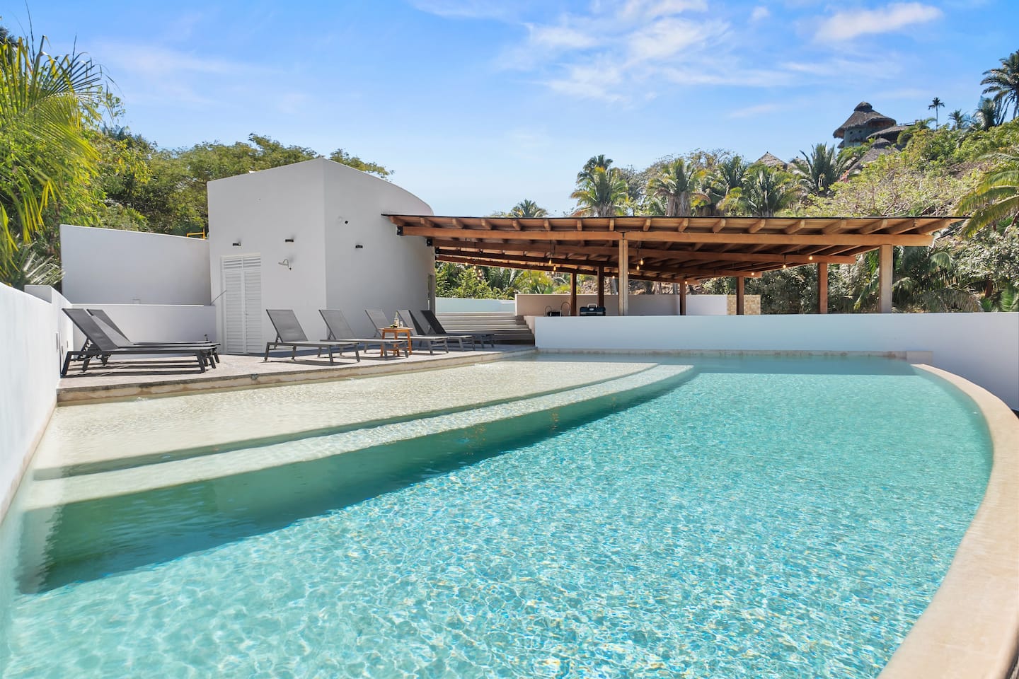 Your pool from a different angle: curved, clean, and always warm.