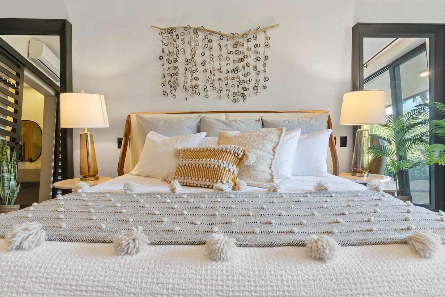 Your bed for the week. That pom-pom throw is softer than it looks. Give the pillows a chance.