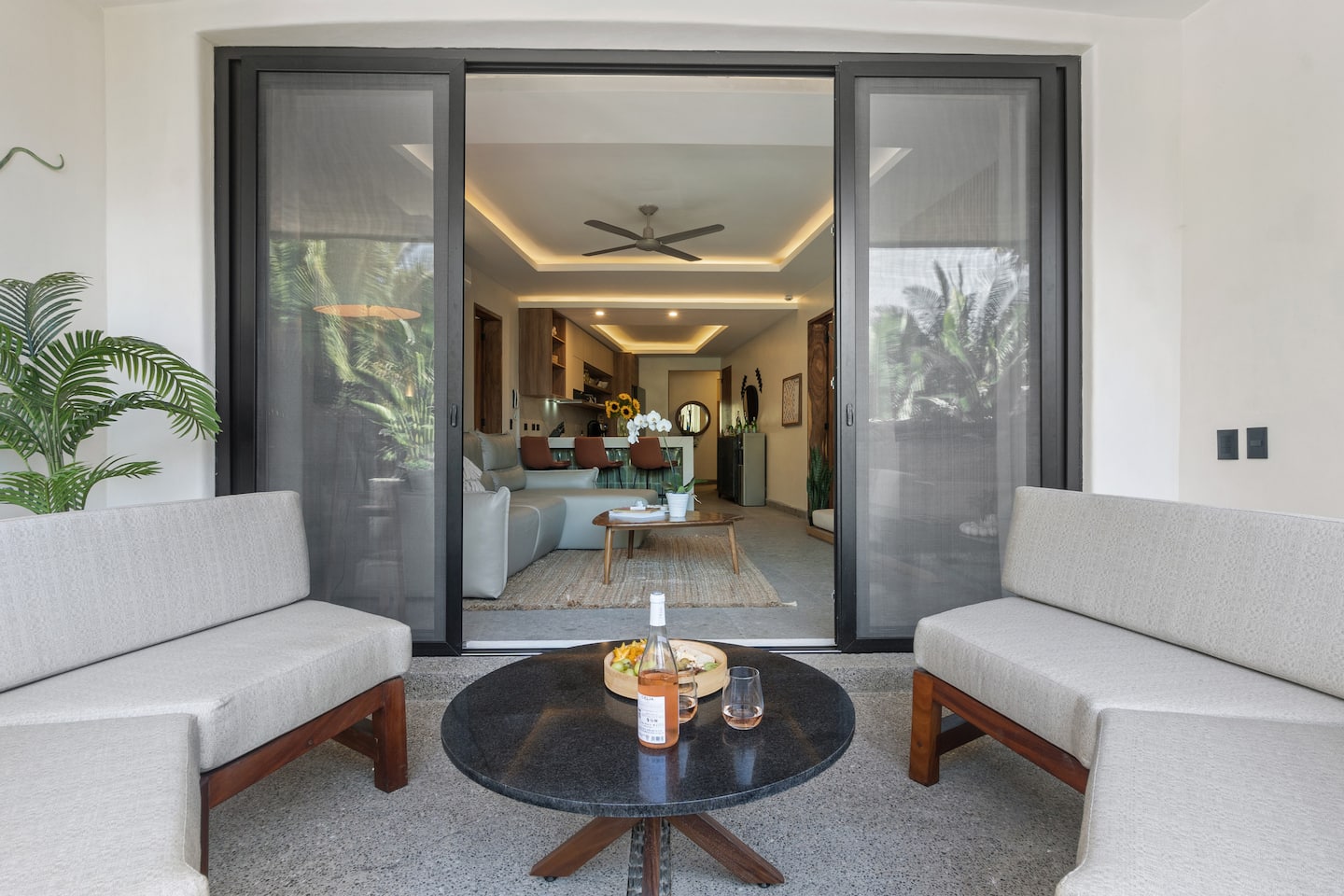 Step onto the terrace with a glass and prop the doors open, and let the evening drift between in and out.