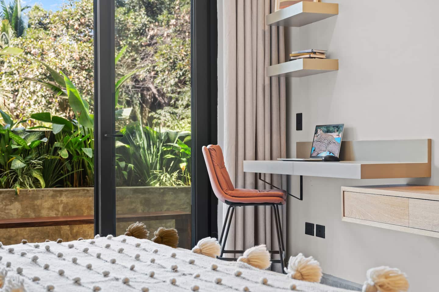 Get some work done at your floating desk. The jungle view through the glass makes it worth opening the laptop.