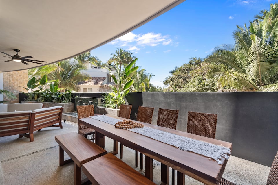 Pull everyone together under the palapa for dinner. The ceiling fan is already on.