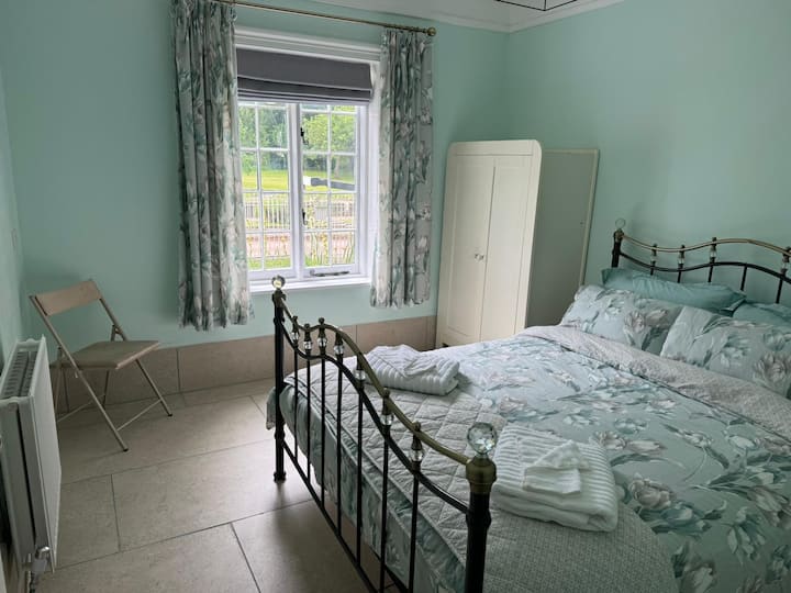 Ground floor bedroom with outlook over the Severn Way and Holt Lock.