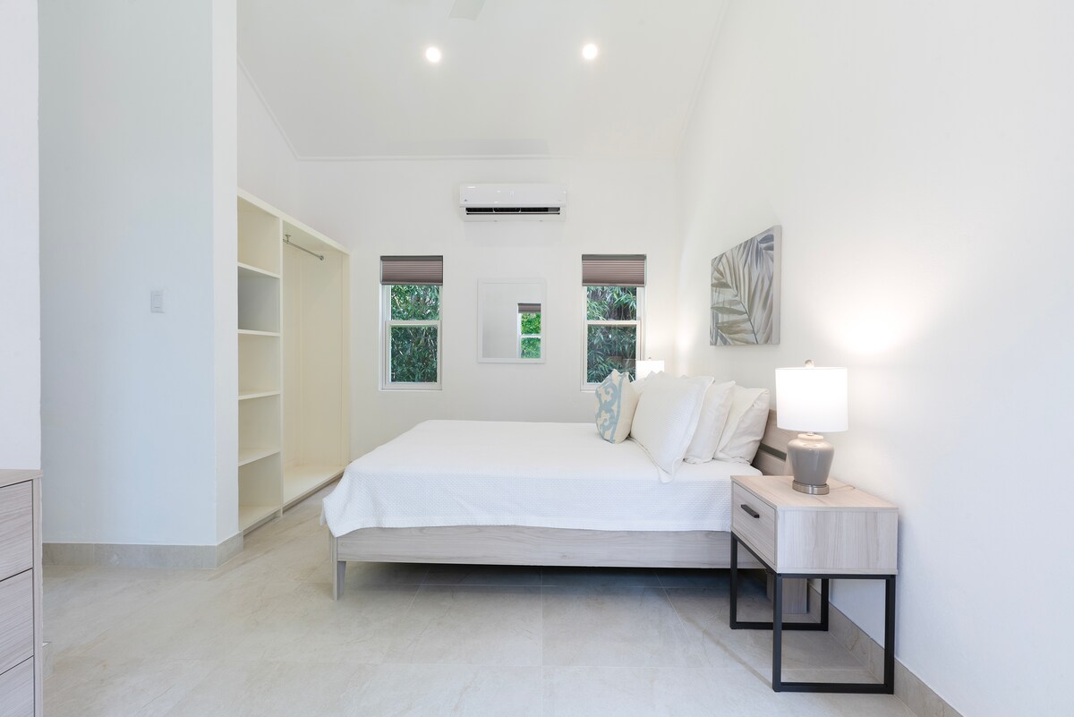 Bedroom 7 within a private cottage has an ensuite and garden views, smart TV, security safe and a filtered shower head.