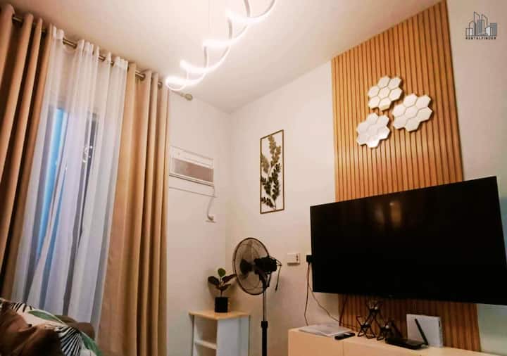 Experience luxury and comfort in this modern condo with elegant interiors. Featuring a cozy sofa, chic lighting, a stylish TV wall, and minimalist décor. Enjoy a smart TV(Netflix-ready) and sleek storage. Book for a relaxing stay in a premium condo!