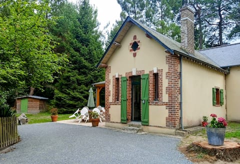 Cottage with pond in the countryside