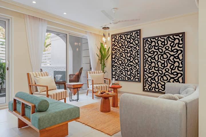 Living room with ample sunlight and seating