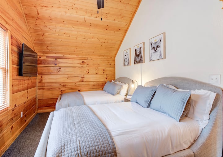 Bedroom 3 has a 55” smart TV and two full beds, to sleep 4. 