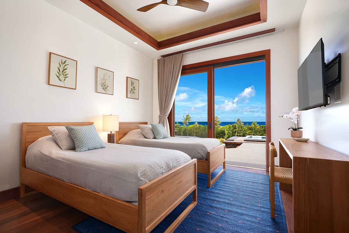 The sixth twin bedroom offers beautiful views of the ocean and pool. At night, drift off to sleep to the soothing sounds of the waves and the distant blowhole — a true island experience