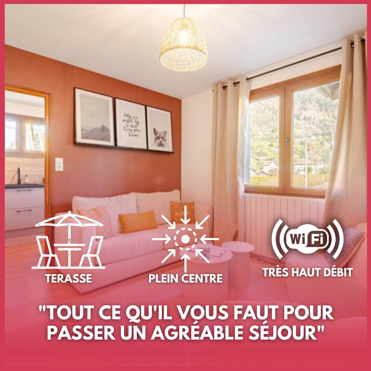 A cozy living area is enhanced by a warm light fixture and features a comfortable sofa. Large windows provide a view of the surrounding mountains. Decorative art pieces adorn the walls, adding a touch of charm to the space. A small dining area is visible in the background.