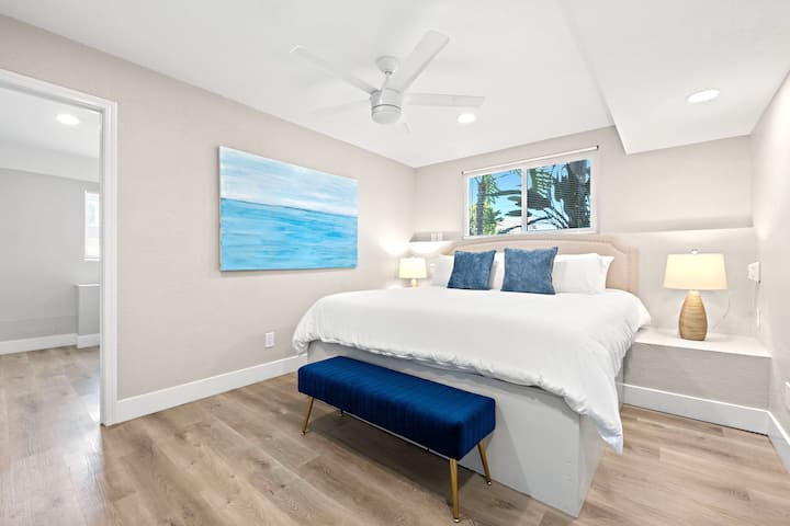 Lovely bedroom with king bed, closet, TV & picture window