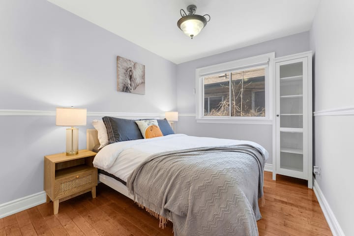 A cozy bedroom designed for comfort, featuring a plush bed and warm decor. This inviting space is perfect for restful nights and relaxation, making it an ideal retreat after a long day.