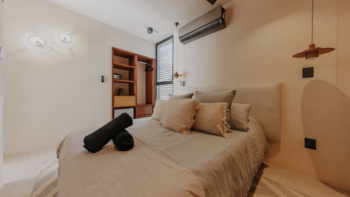 Experience cozy elegance in Bedroom 3, featuring a comfortable queen-sized bed and a private bathroom, offering a serene sanctuary for relaxation and rejuvenation during your stay.