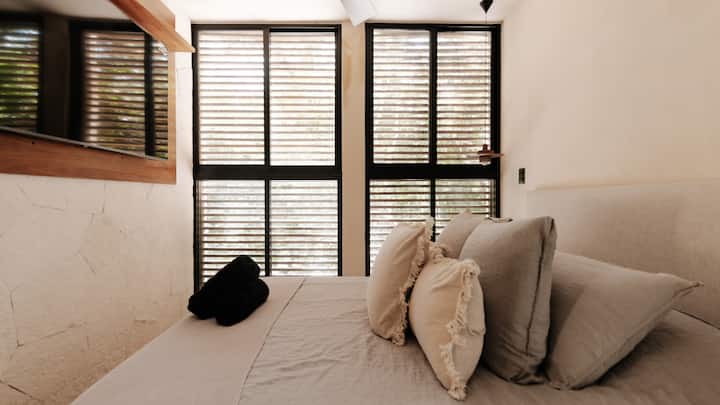 Discover comfort and convenience in Bedroom 4, where a plush queen-sized bed awaits, accompanied by a private bathroom for your ultimate relaxation and privacy during your stay.