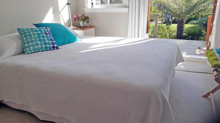 Second Bedroom. 
Queen size bed. Opening french doors to a garden view