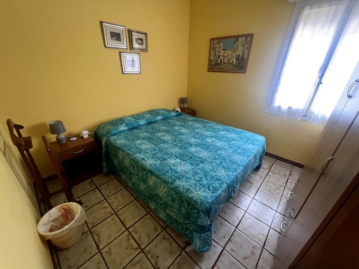 This smaller room has sufficient space for a queen size bed with side tables and an armoire