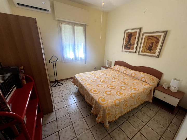 This generously-sized bedroom is located next to the green bathroom, upstairs. The window opens to the back of the home.