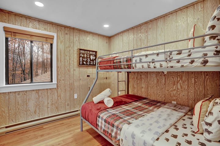 Family-friendly bunk room with a twin over full bed: kids above, an adult can rest comfortably below.
