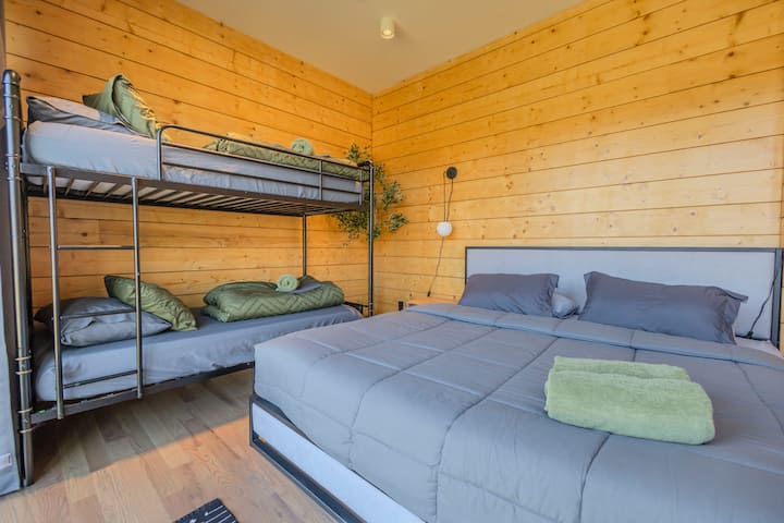 Restful Oasis: Unwind in a master suite designed with relaxation in mind, featuring plush comforts and an expansive ensuite bathroom.