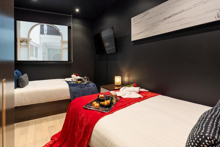 Enjoy the comforts of this serene 2 small double bedroom, outfitted with crisp linens and a 50-inch TV, perfect for a movie night after a day of exploration.