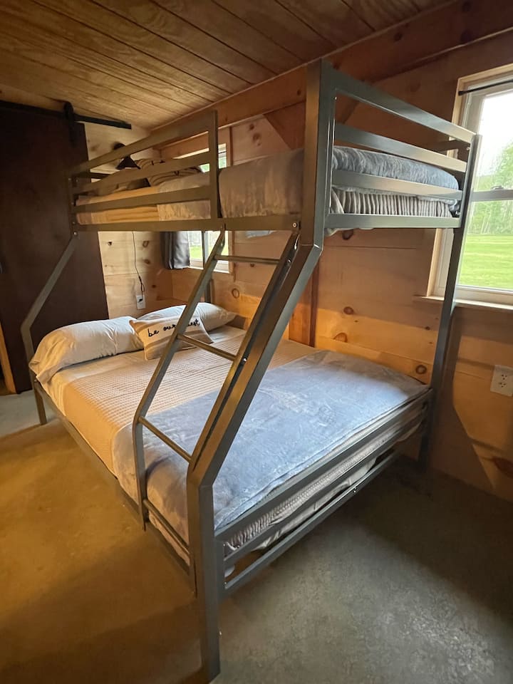 Twin over full bunkbed provides room for 3, ladder access and all bedding provided.