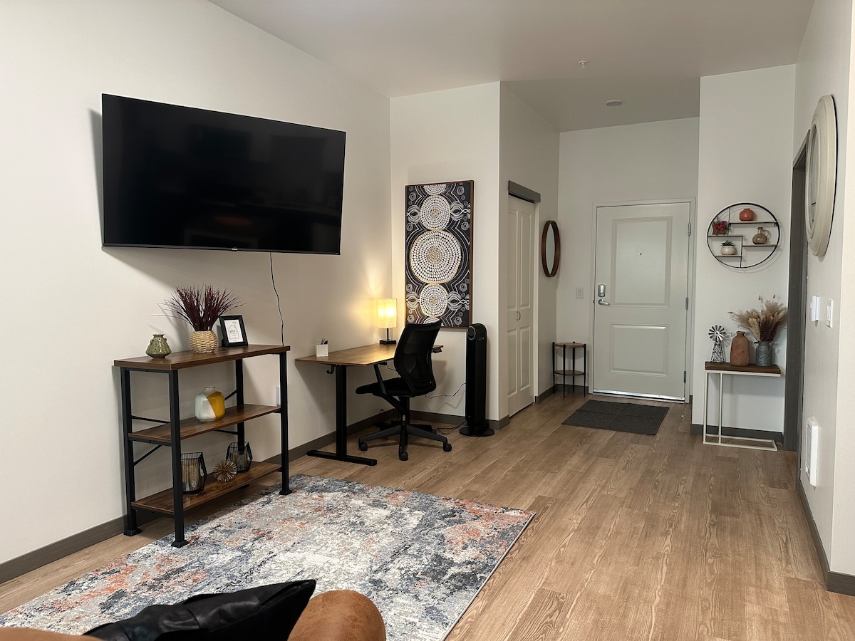 You will find a 55" Smart TV for streaming all your favorite shows in the living room.