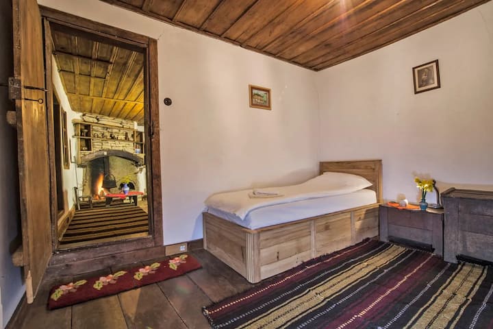 Immerse yourself in the beauty of Central Balkan rural architecture, our traditional bedroom is a celebration of history, craftsmanship, and nature. With wooden furniture, rustic interior, and peaceful surroundings, this space shows rural Bulgaria.