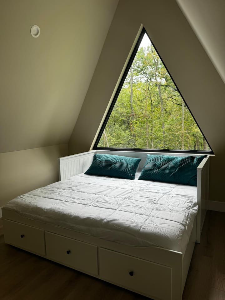 On the top floor just outside Bedroom #1 is a daybed that converts to a king bed