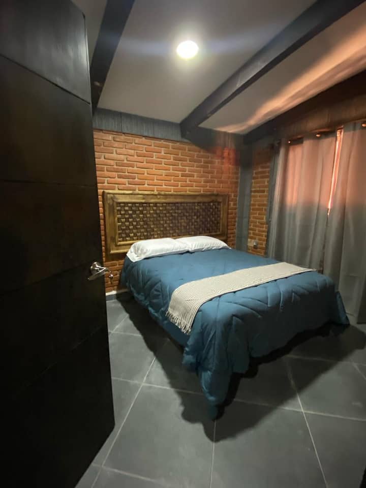 Bedroom, with queen size bed and black out curtains, for your best rest.