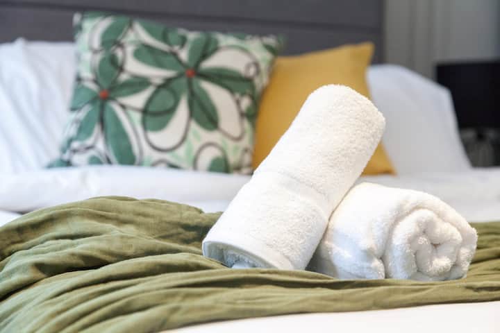 Comfortable and stylish bedroom with a calming colour palette.
Well-dressed bed with soft linens and thoughtful decorative touches.
Perfect for a restful night’s sleep in a peaceful setting.








