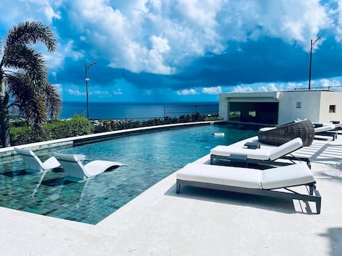 2BR Apt with Pool & Ocean Views, Near Amenities
