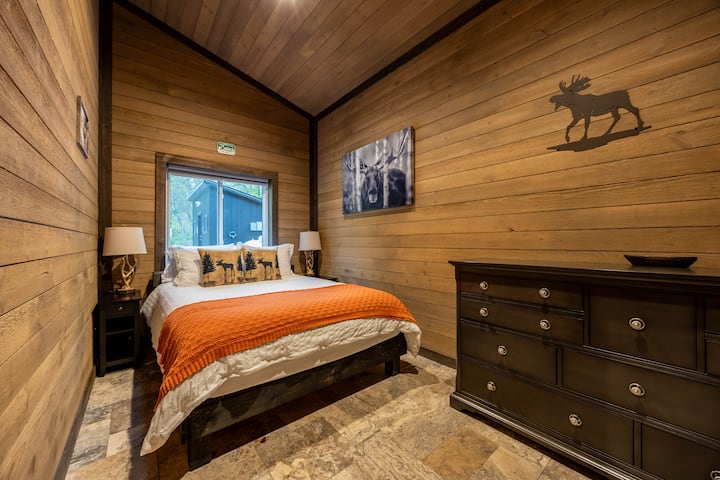 Cozy guest bedroom featuring warm linens and relaxing vibes.