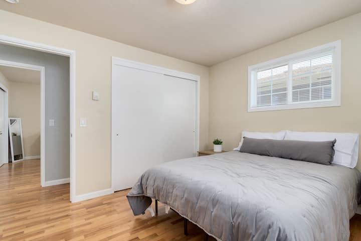 Queen bed with comfortable linens and large closet.